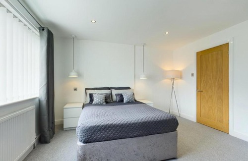 Hazlerigg Apartment | Cheerful 2 - bedroom home with free parking.