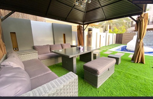 Al Hamra Village Villa | Cheerful 4-bedroom Villa with pool and BBQ area