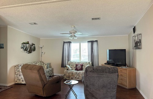 Barefoot Bay House | Cheerful Barefoot Bay vacation rental