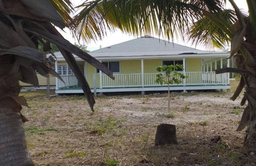 Mars Bay Settlement Villa | Cheerful one bedroom villa with a patio.