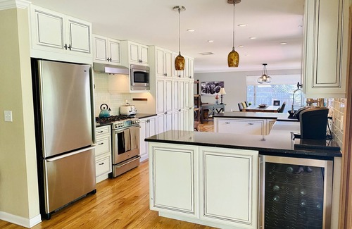 Southeast House | Cheerful three bedroom with stunning sunroom!