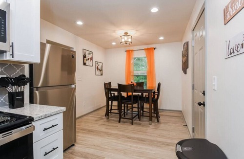 Browns Mill Park House | Cheerful Upstairs Unit of Guest Home with Private Terrace, BBQ Area & Yard Games