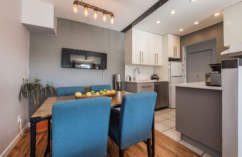 Riley Park Condo | Cheery bright condo with garden space in lively neighborhood