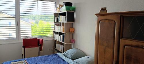 Courtepin House | Chez Elsa et Agou - chambre confortable chez l'habitant