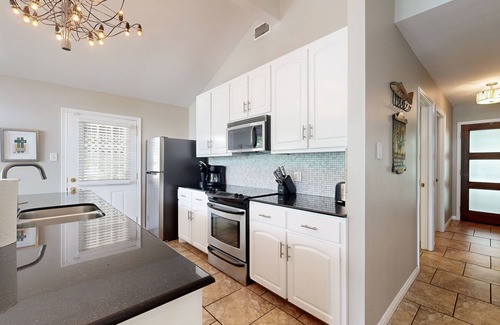 Saratoga Point House | Chic home on Lake Austin with dock, lovely deck, vibrant interior & views
