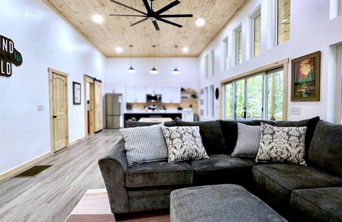 Campton Cabin | Chic modern cabin in a magical forest. Hot Tub, Swinging Bed, WiFi, & EV Charger