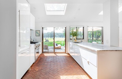 Hay Beach House | Chic modern mid century home with saltwater pool and expansive views