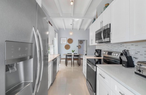Dolphin Isles Apartment | Chic Modern Oasis with Pool – Steps from the Shore