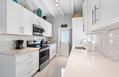 Dolphin Isles Apartment | Chic Modern Oasis with Pool – Steps from the Shore