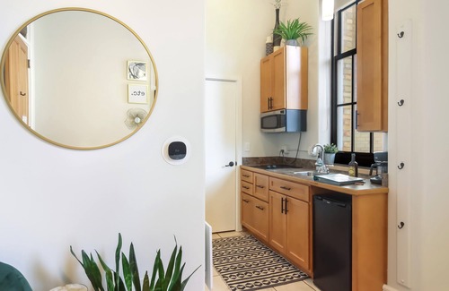 Traverse City Condo | Chic Studio in Historic Village~Walk to Restaurants, Shops, and Trails!