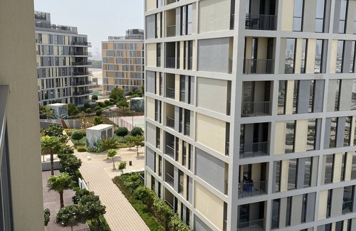 Dubai Production City Condo | Chic urban retreat in coveted resort-style spot with pool gym tennis court