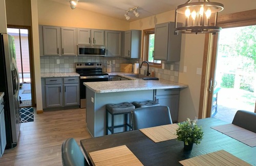 Durand House | Chippewa Riverfront Retreat Sleeps 8 and Hot Tub