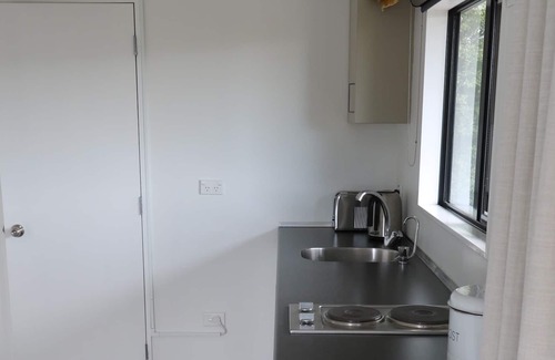 Diamond Harbour Cottage | Church Bay cabin: sunny, great views