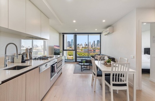 North Melbourne Apartment | City Views & Inner-North Cool at Your Door