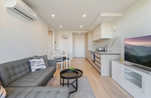 North Melbourne Apartment | City Views & Inner-North Cool at Your Door