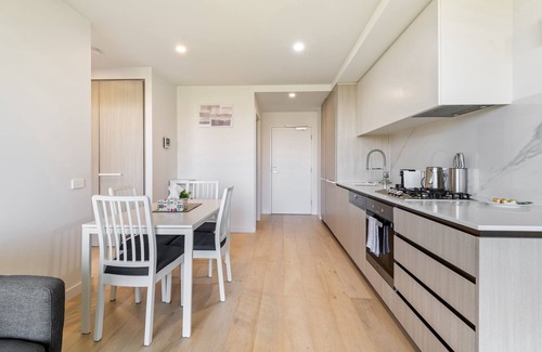 North Melbourne Apartment | City Views & Inner-North Cool at Your Door