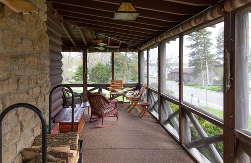 Lake Ripley Cottage | Classic cabin/cottage with big screen porch, stone fireplace, knotty pine walls.
