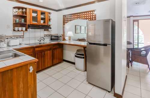 Damas Condo | Clean & Bright Getaway W/ Shared Pool, Lush Gardens, & Ideal Location Near Town!