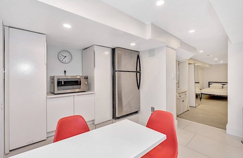 East Danforth House | Clean, white, bright and close to Woodbine subway