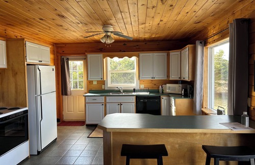 Souris Cottage | Close to Beach and Town of Souris. Quaint cottage with lovely log cabin feel.