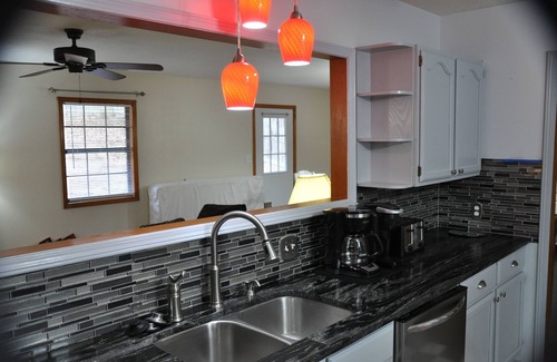 Rogers House | Close to town! Lake view, fire pit, fenced backyard