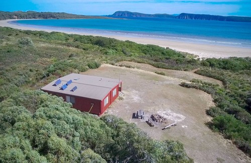 South Bruny Cabin | Cloudy Bay Cabin - Sometimes, the simplest pleasures in life are the best. This sums up Cloudy Bay Cabin; an unpretentious and welcoming little timber cottage surrounded by South Bruny National Park and just metres from the shores of beautiful Cloudy