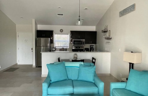 Wheeland Settlement Condo | “Coastal Bliss: Stunning 2-Bedroom Condo with breathtaking Beach and Pool Views”
