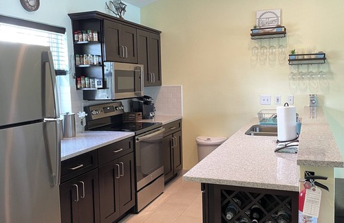 Wheeland Settlement Condo | “Coastal Bliss: Stunning 2-Bedroom Condo with breathtaking Beach and Pool Views”