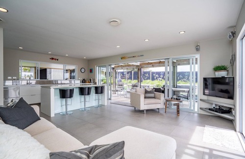 Mangawhai Heads House | Coastal Charmer - Modern holiday home with multiple covered outdoor entertaining spaces and spa