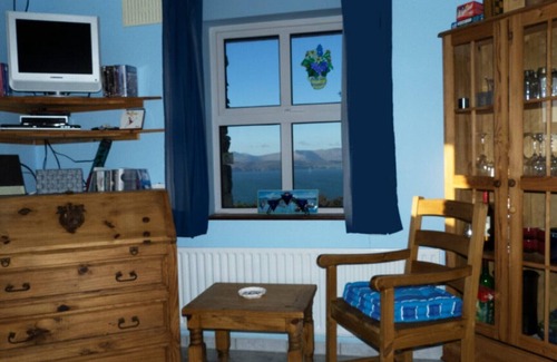 Kells House | Coastal Cottage with magnificent sea and mountains.