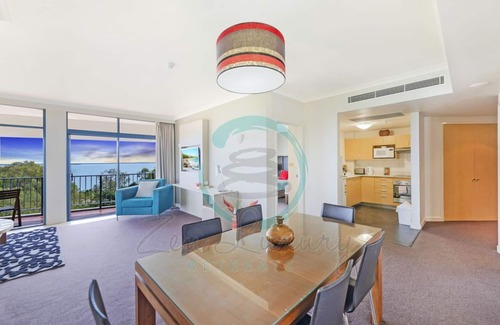 Darwin City Centre Apartment | Coastal Elegance Sunset Pool Balcony Dining