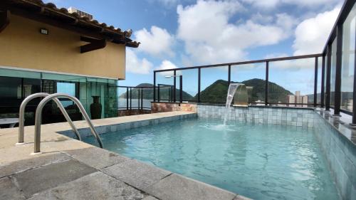 Tombo Apartment | Cobertura Luxuosa, pe na areia - Exclusividade na Praia do Tombo, Guarujá, a Mais Premiada com Bandeira Azul no Brasil