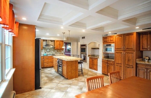 Benton Harbor House | Colonial style 5BR/5BA home tucked in a private, wooded setting w/pool & hot tub