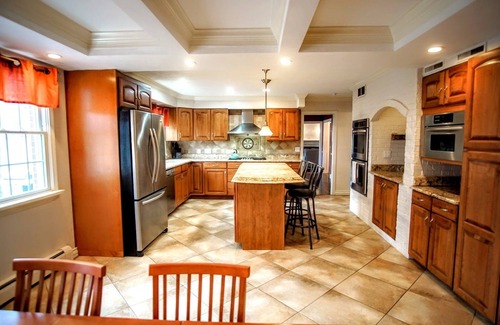 Benton Harbor House | Colonial style 5BR/5BA home tucked in a private, wooded setting w/pool & hot tub