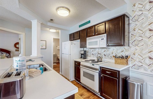 Sunset Beach Condo | Colony II at Oyster Bay condo | fast WiFi, seasonal pools, hot tub, fitness room