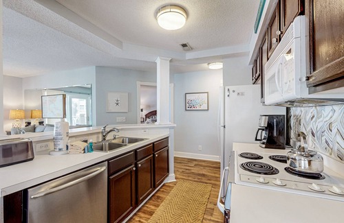 Sunset Beach Condo | Colony II at Oyster Bay condo | fast WiFi, seasonal pools, hot tub, fitness room