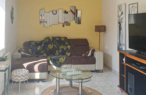 Chaumes-en-Retz House | Colorful and cozy vacation home with a beautiful veranda and garden overlooking the forest.