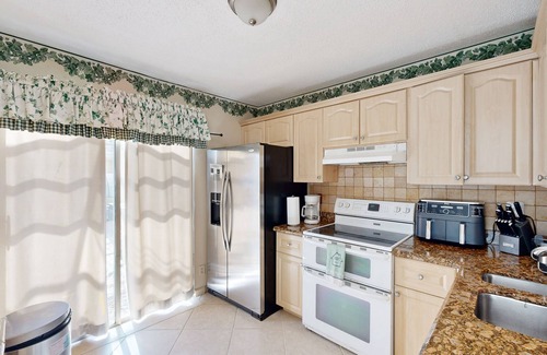 Whisper Walk House | Colorful dog-friendly home with pool, grill, work desks, internet, AC, & W/D