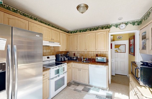 Whisper Walk House | Colorful dog-friendly home with pool, grill, work desks, internet, AC, & W/D