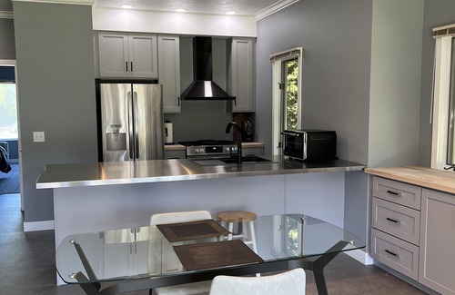 Cedar Condo | Come cozy up next to the fireplace at our contemporary condo centrally located
