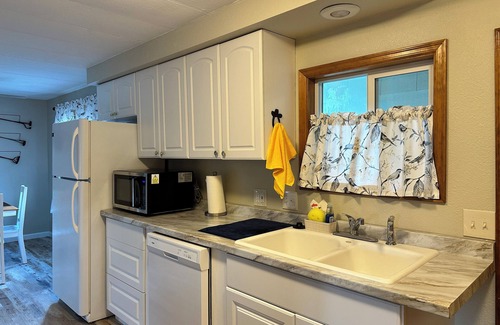 Wilbur House | Come for the Sun, Stay for the Fun in this charming 3 Bedroom Porch Home