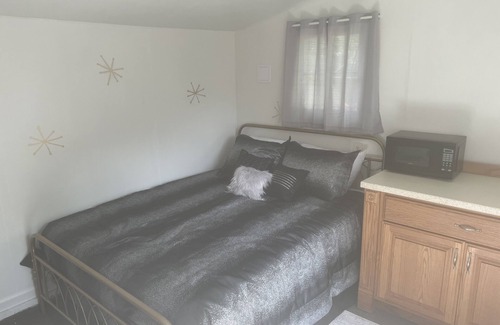 Chanute House | Come stay in this unique peacful cabin, tucked away in our large yard.