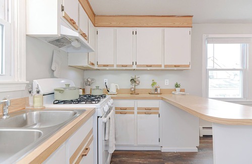 Lowell Apartment | Comfort Oasis with Private Garage. Steps from UMass Lowell & 35 min from Boston