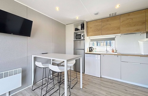 Jullouville-les-Pins House | Comfortable 2-Bedroom Mobile Home with Terrace, Near Beach, Pool & Parking in Jullouville
