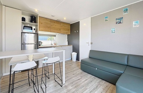 Jullouville-les-Pins House | Comfortable 2-Bedroom Mobile Home with Terrace, Near Beach, Pool & Parking in Jullouville