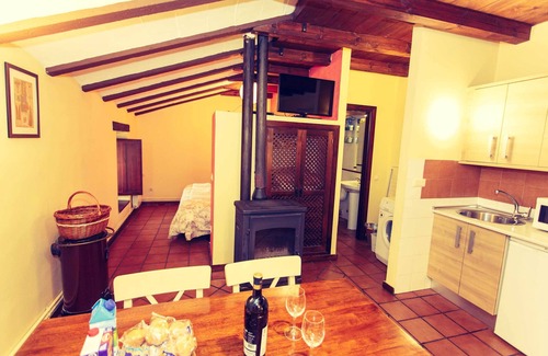 Robregordo Ski Chalet | Comfortable bedroom apartment sofa bed and fireplace on the first floor