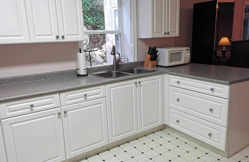 Broadmead House | Comfortable ground level suite with large yard access.