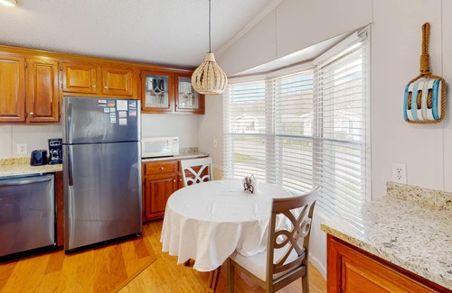 Assateague Pointe House | Comfortable home with tennis court, jetted tub, pool, W/D, patio, & full kitchen