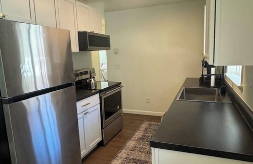 Williston Apartment | Comfy 2BR Retreat – Walk to Shops & Dining!