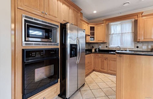 Marpole House | Comfy bedroom with 1/2 bath